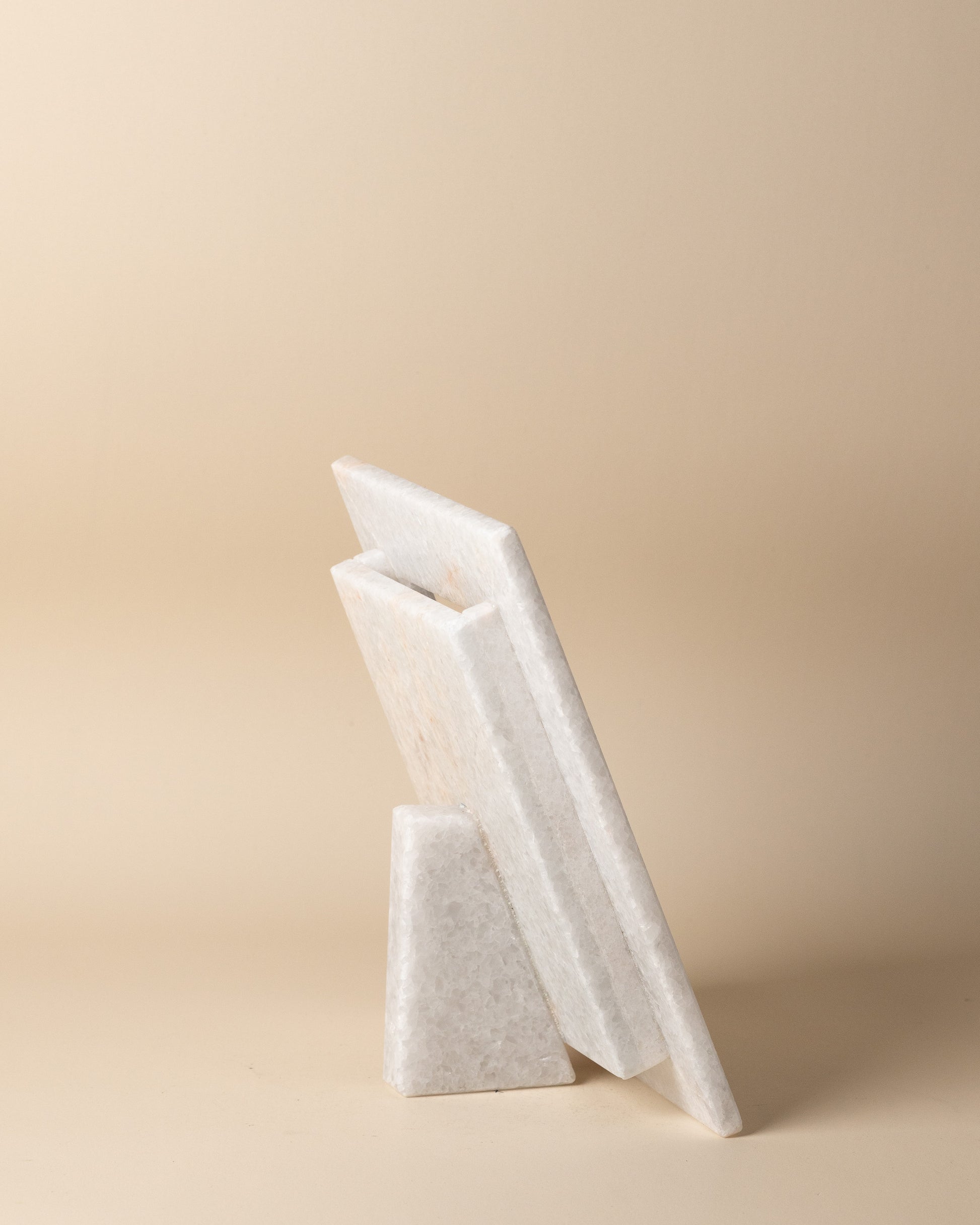 White marble picture frame on a beige background